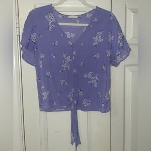 Lush purple button down blouse with white daisies and a front tie in Large.